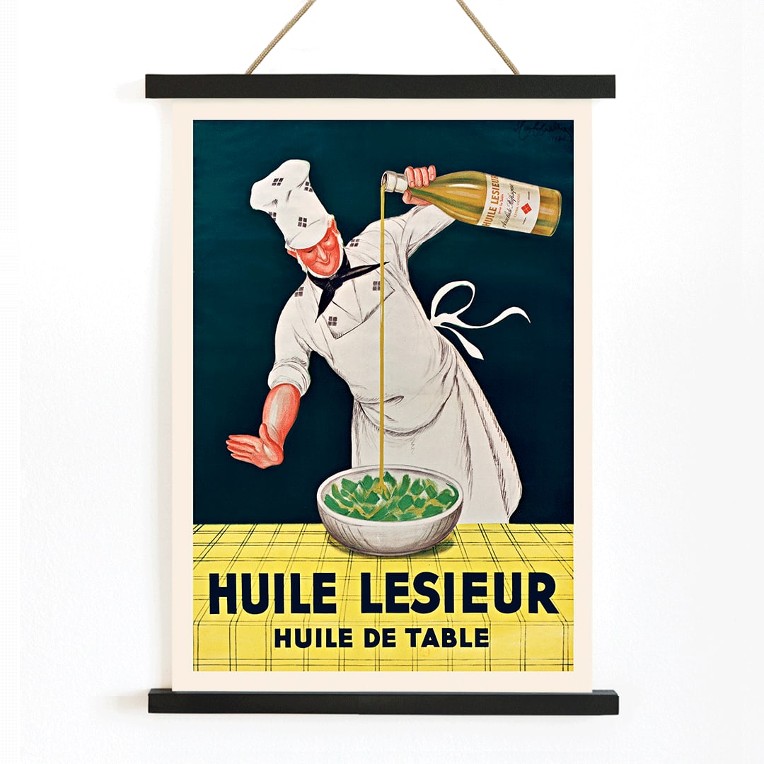 Chef pouring oil into salad Huile Lesieur poster by Leonetto Cappiello, with wooden magnetic frame on white background