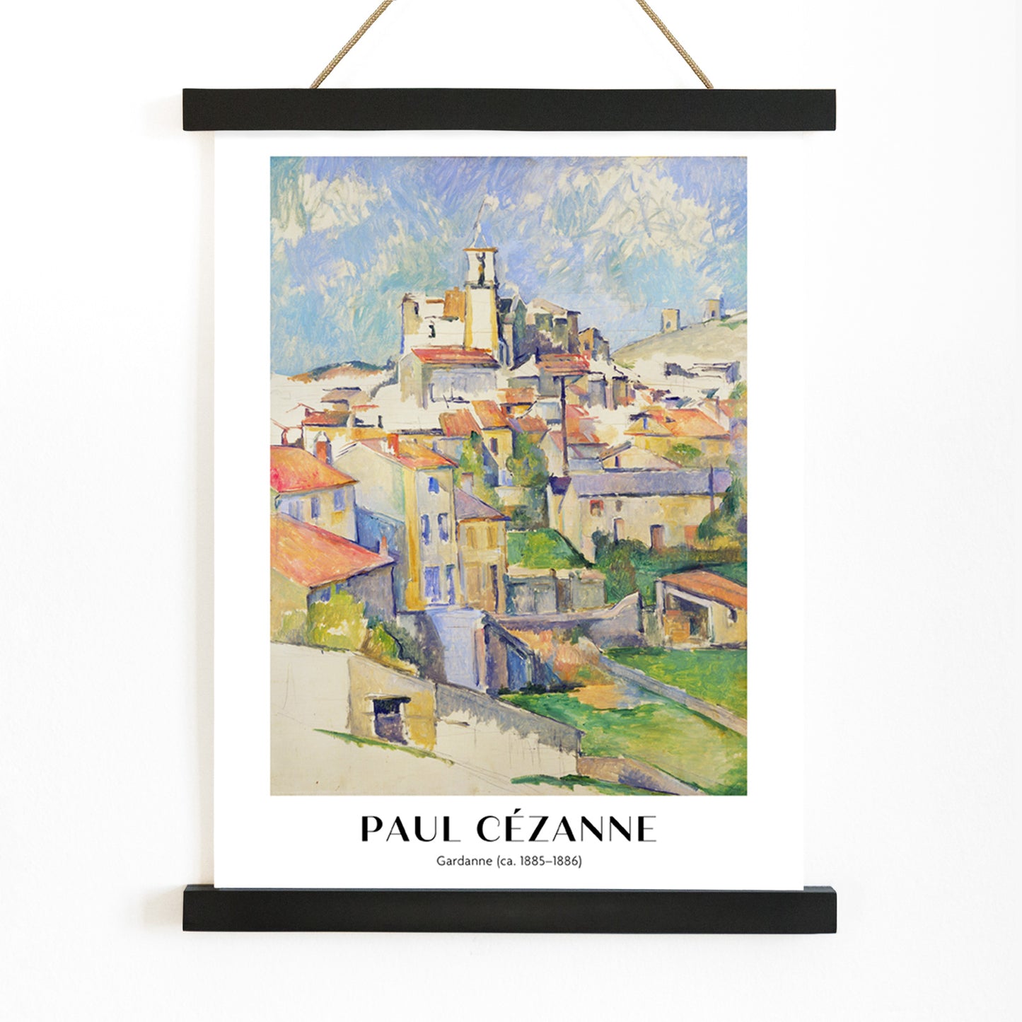 Colorful village landscape painting and poster of Gardanne by Paul Cézanne featuring red roofed houses and bright sky, with wooden magnetic frame on white background