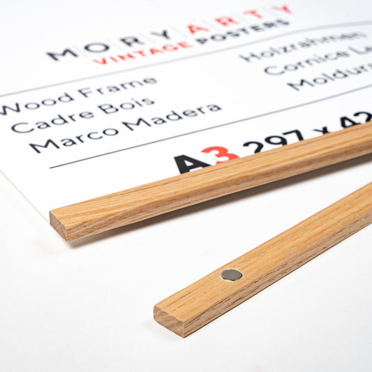 Light oak magnetic wood frame holding a poster, with natural wood bars and a hanging rope, displayed on a wall for a modern, elegant look, back corner closeup picture