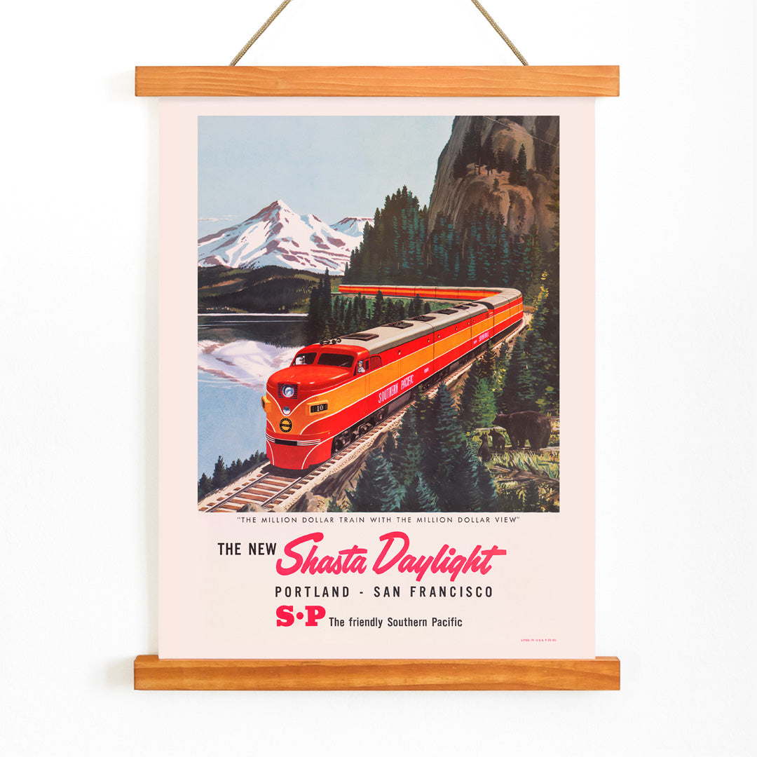 Colorful red train traveling through scenic mountain landscape Shasta Daylight Portland San Francisco vintage artwork poster, with wooden magnetic frame on white background