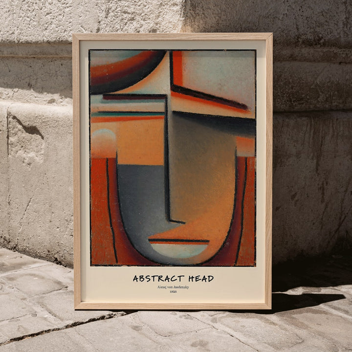 Abstract Head Tragic by Alexej von Jawlensky geometric abstract painting and poster with warm tones and stylized face, framed and displayed in modern living room decor