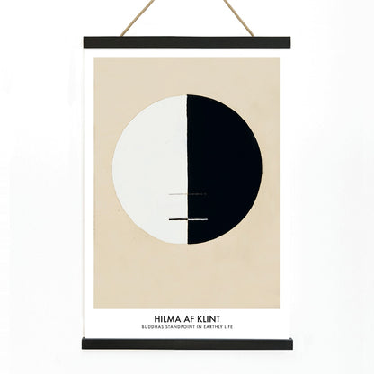 Black and white circle artwork poster Buddha Standpoint In Early Life by Hilma AF Klint with divided circle on beige background, with wooden magnetic frame on white background