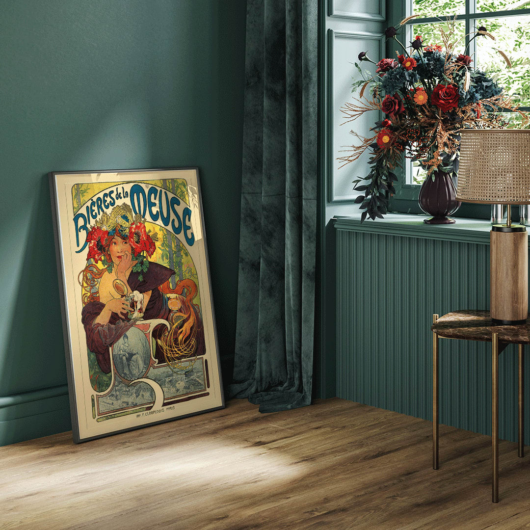 Art Nouveau poster of a woman with flowers in her hair holding a beer glass Bières De La Meuse by Alphonse Mucha, framed and displayed in home decor