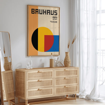 Bauhaus Poster 1 inspired by the Weimar Exhibition featuring geometric shapes in warm bold colors and modernist design style, framed and displayed in home decor