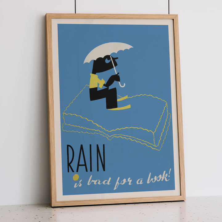 Arlington Gregg Rain Is Bad for a Book poster blue minimalist figure under white umbrella above book, with wooden magnetic frame on white background