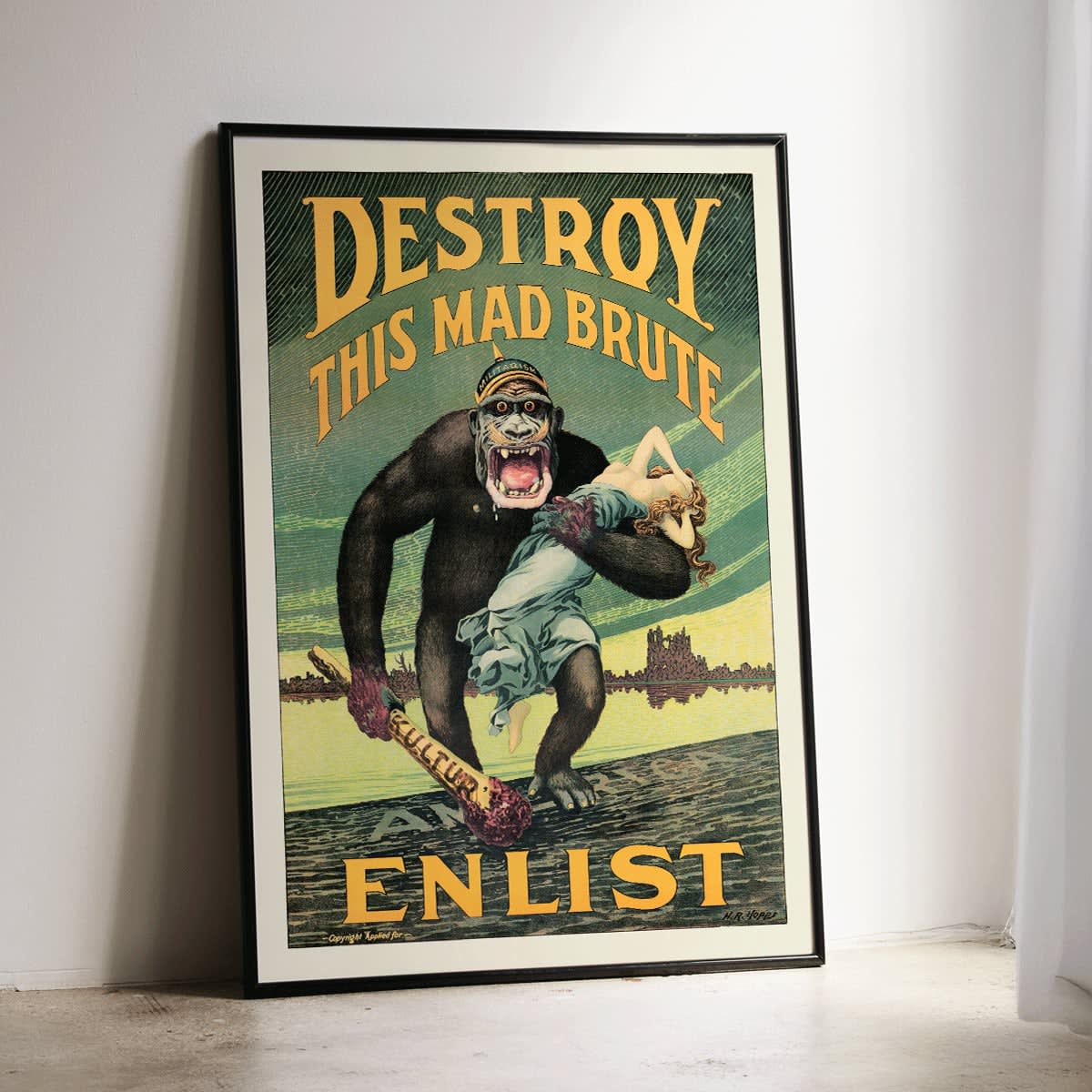 Destroy this mad brute by Harry Ryle Hopps poster featuring a gorilla holding a woman and a club labeled Kultur with enlistment message, framed and displayed in modern living room decor