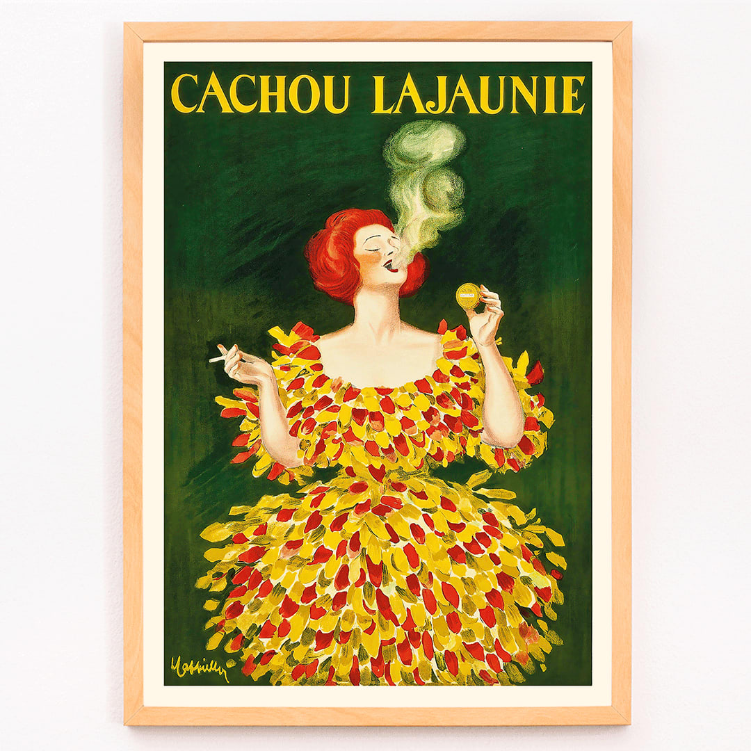 Colorful poster Cachou Lajaunie by Leonetto Cappiello featuring a woman in a vibrant dress with smoke forming a face and holding a cigarette, framed and displayed in modern living room decor