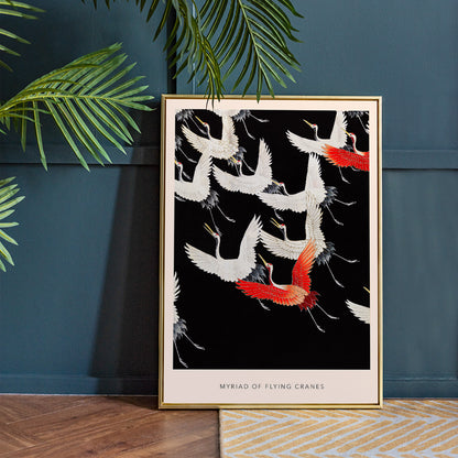 Furisode with a Myriad of Flying Cranes traditional Japanese artwork poster featuring elegant white and red cranes in flight on a black background, framed and displayed in home decor