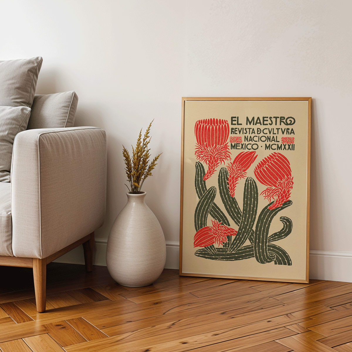 Vibrant cover art of El Maestro Revista de cultura nacional Mexico featuring red flowers and green cacti by Jose Posada, framed and displayed in modern living room decor