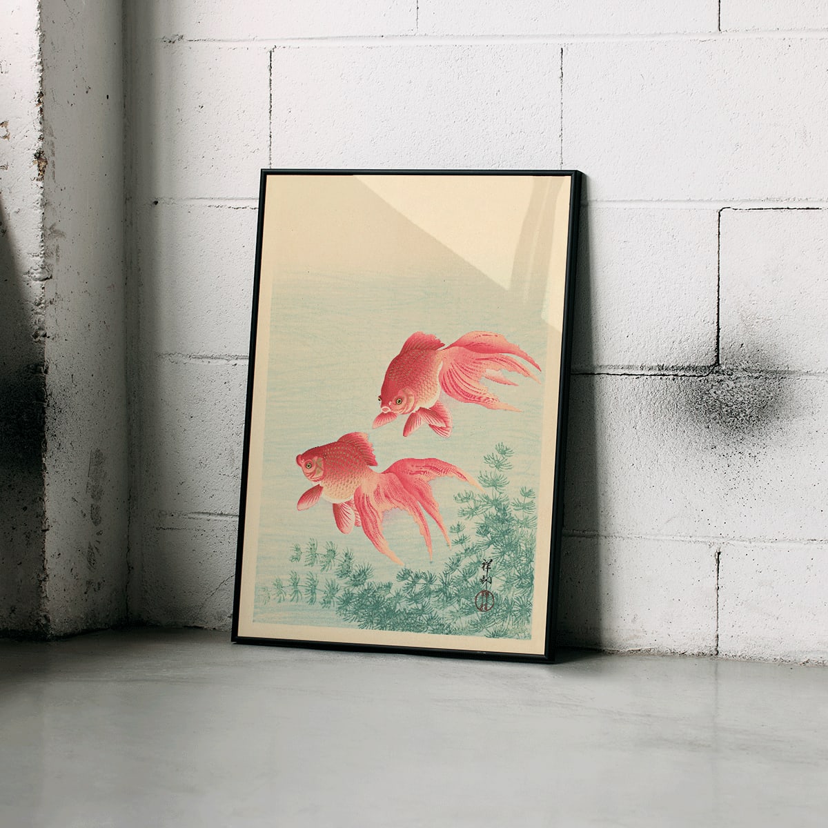 Two Goldfishes by Ohara Koson poster with two vibrant goldfish swimming among aquatic plants in blue water, framed and displayed in modern living room decor
