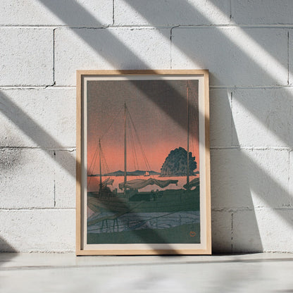 Ukiyo e Harbour Sunset by Kawase Hasui with boats docked at sunset tranquil evening sky island and mountains in background, framed and displayed in modern living room decor