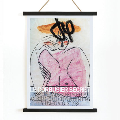 Secret Ahrenberg Collection Exhibition poster by Le Corbusier featuring abstract art with bold lines and vivid colors, with wooden magnetic frame on white background