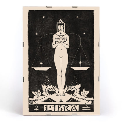 Art Nouveau Libra zodiac sign illustration by Henri van der Stok featuring a woman holding balanced scales and stars, framed and displayed in modern living room decor