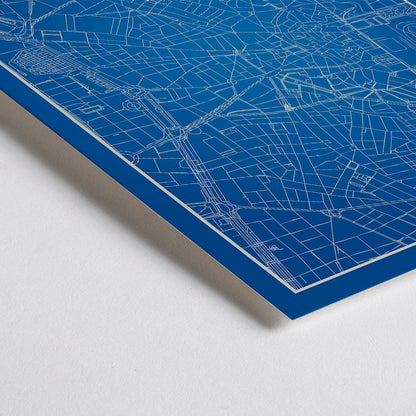 Closeup detail of Minimalist Madrid Map by Artist Name blue and white city layout with silhouettes and street details poster