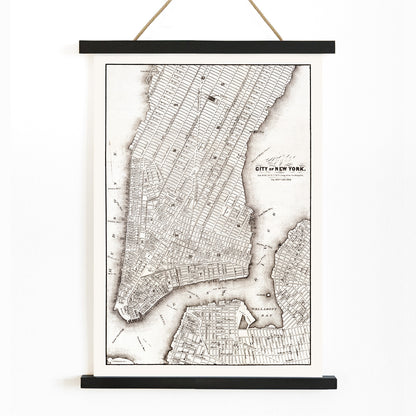 Vintage map of New York City showing detailed streets and layout from Library of Congress Geography and Map Division titled Map of the City of New York, with wooden magnetic frame on white background