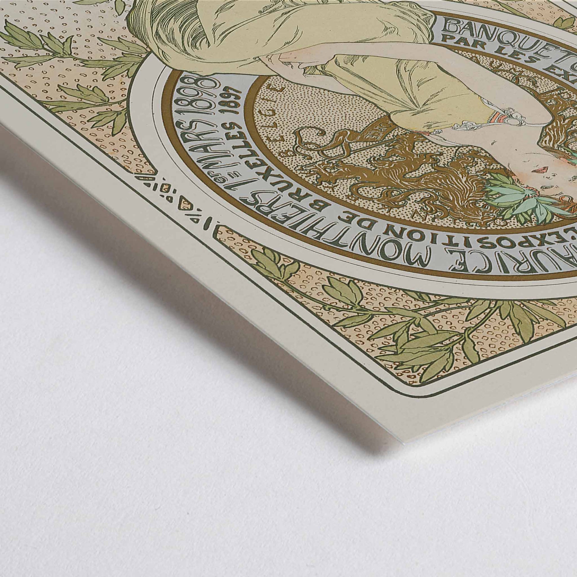 Closeup detail of Alphonse Mucha Exposition de Bruxelles Art Nouveau poster with graceful woman and floral ornaments in soft green and beige tones