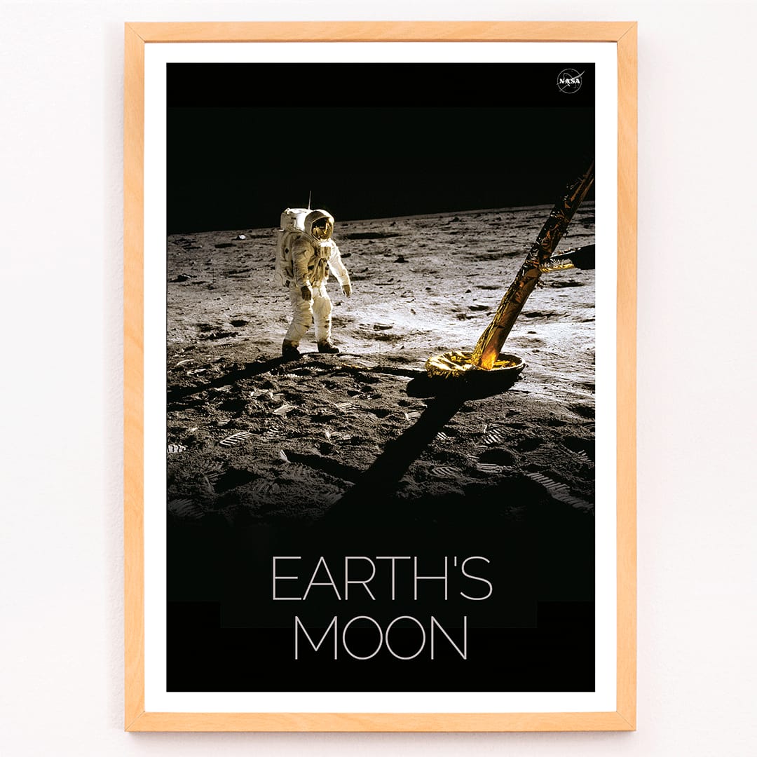 Astronaut on the lunar surface with text Earths Moon Man on Moon 2 by NASA poster, framed and displayed in modern living room decor