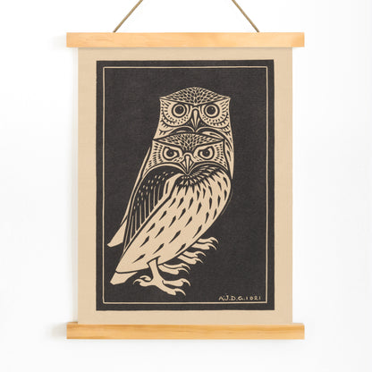 Stylized black and white owls artwork by Julie de Graag titled Two black and white owls illustration and poster, with wooden magnetic frame on white background