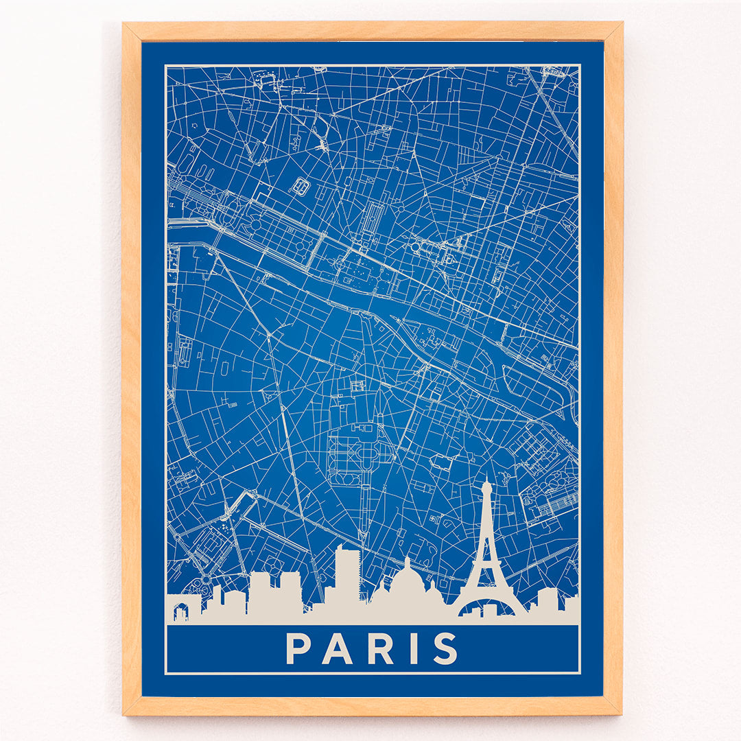 Minimalist Paris city map artwork and poster featuring detailed blue and white map with Eiffel Tower and prominent Paris landmarks, framed and displayed in modern living room decor