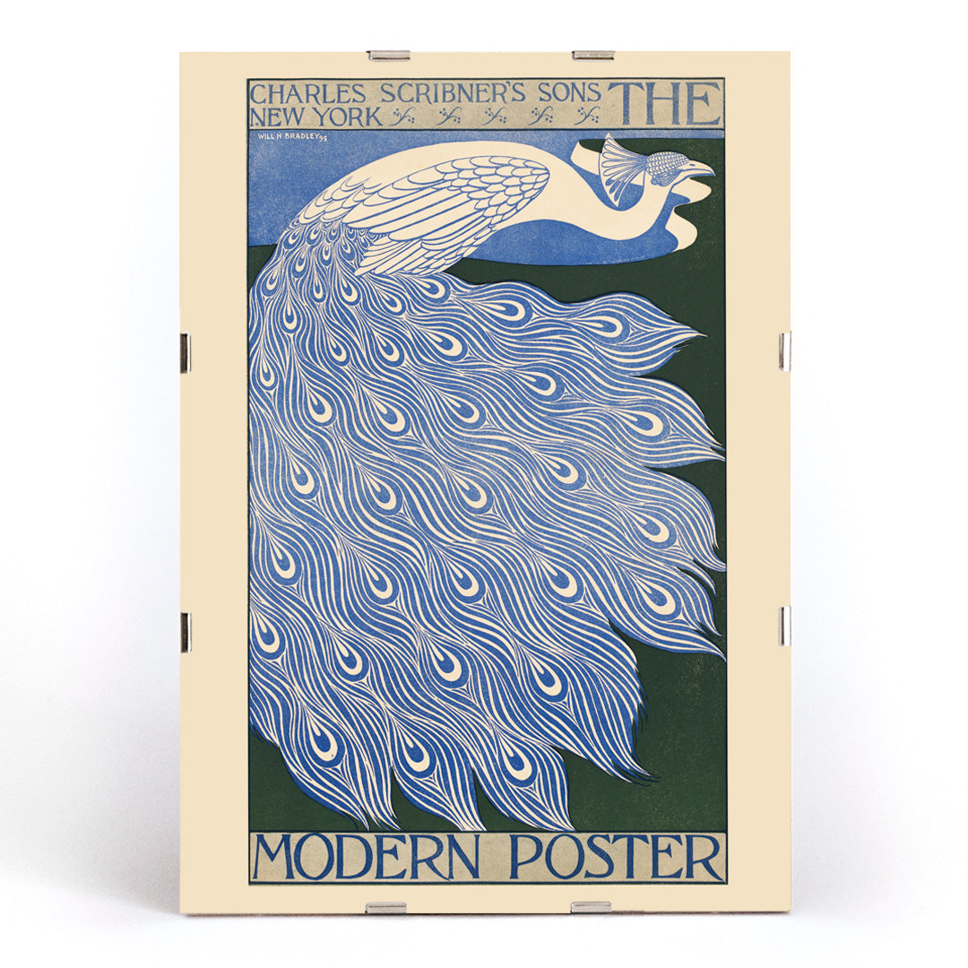 Elegant blue and white peacock with flowing feathers illustration from The Modern Poster by Will Bradley, framed and displayed in modern living room decor