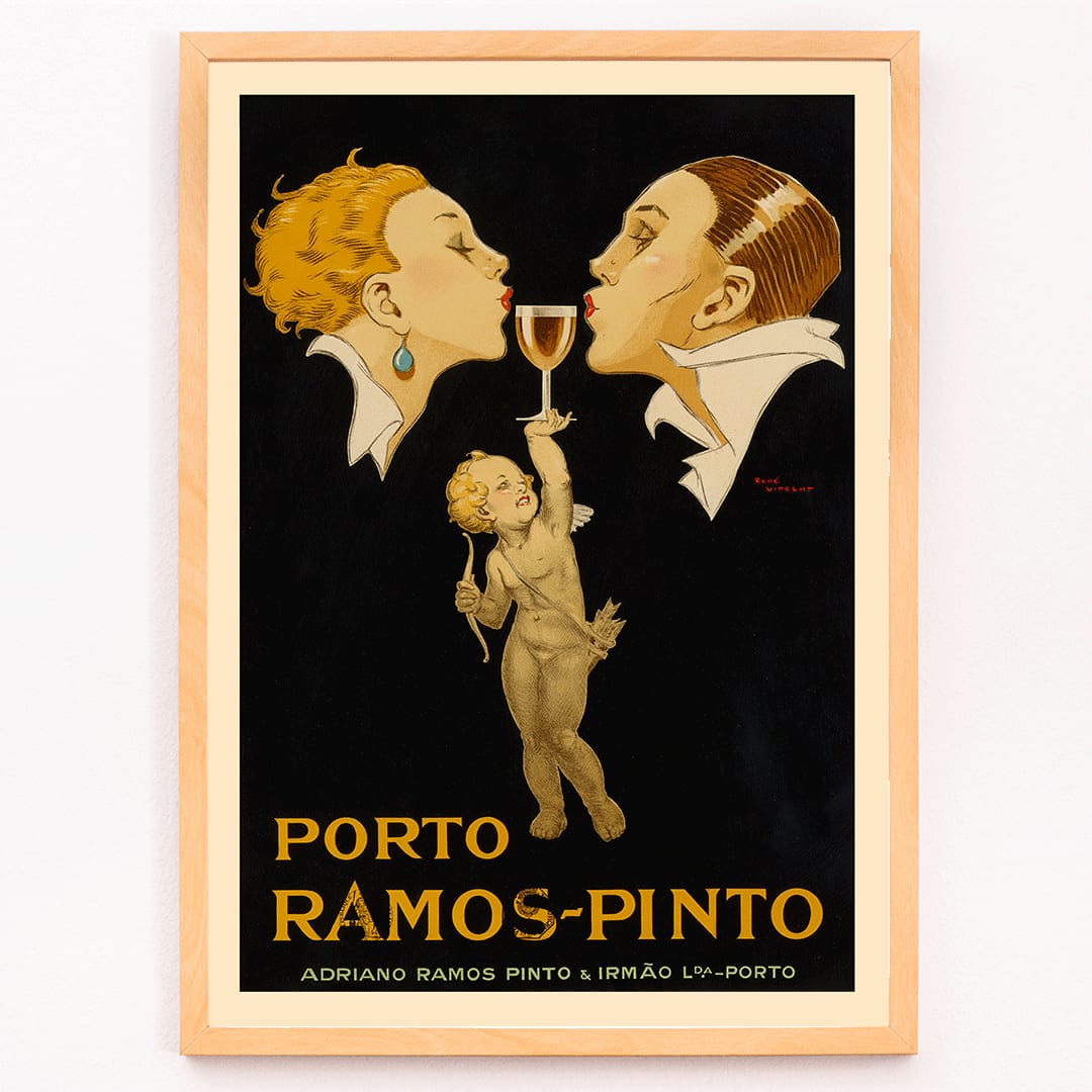 Porto Ramos-Pinto poster by Rene Vincent with two people about to kiss and a cherub holding a wine glass, framed and displayed in modern living room decor
