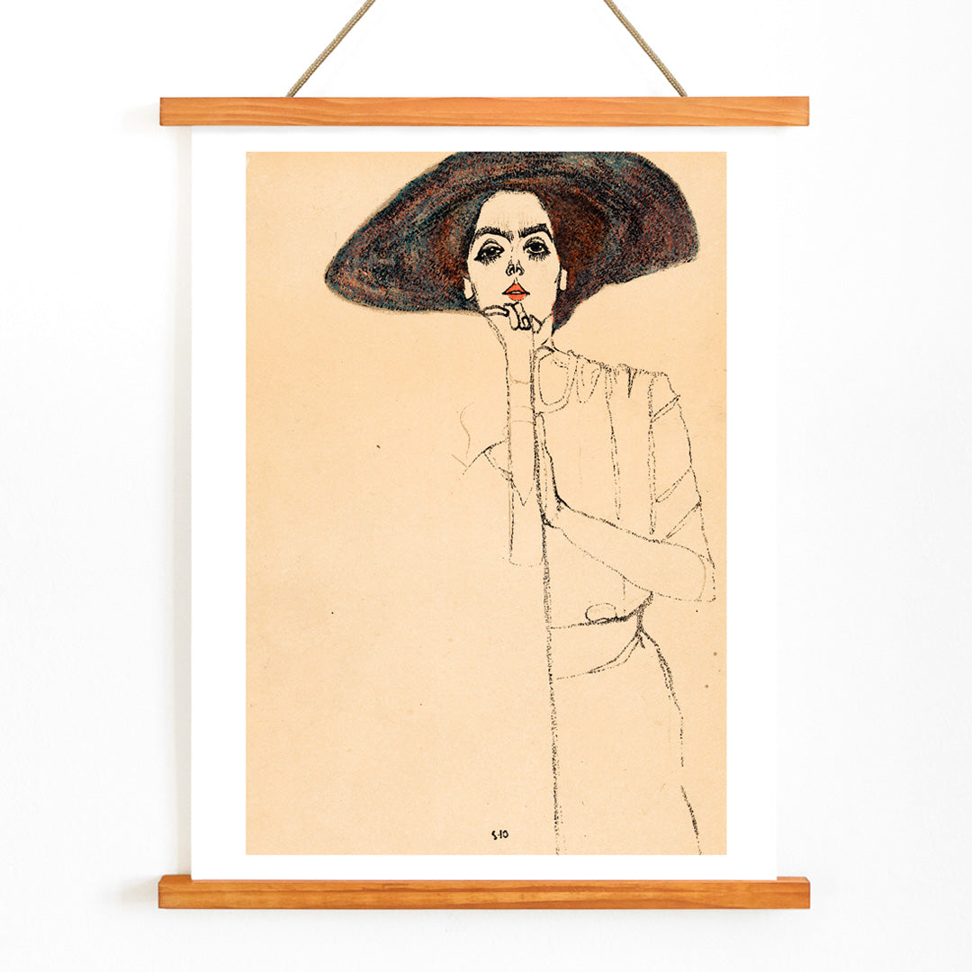 Frauenbildnis II by Egon Schiele poster featuring a woman in a large hat expressive minimalistic line drawing on beige background, with wooden magnetic frame on white background