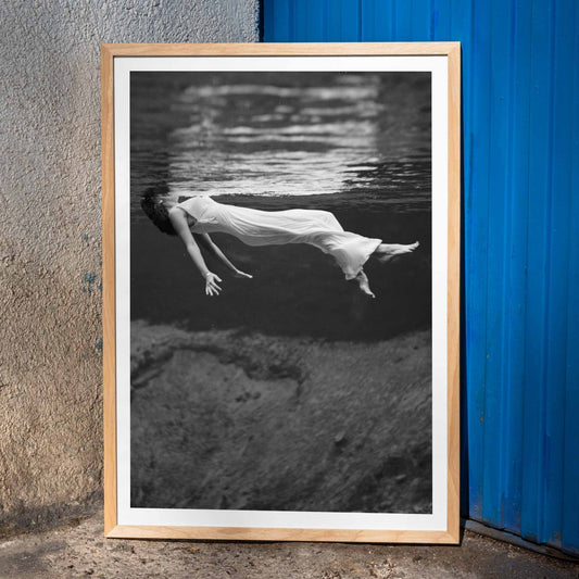 Underwater woman in white flowing dress at Weeki Wachee spring Florida by Toni Frissell, framed and displayed in home decor