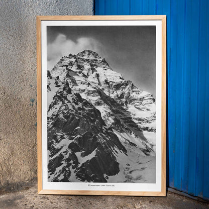 Black and white photograph and poster of K2 west face by Vittorio Sella showing the snow-covered mountain peak, framed and displayed in home decor