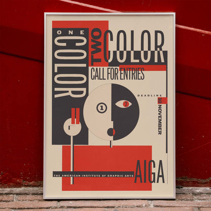 AIGA poster by Michael Mabry titled One color two color call for entry featuring bold geometric design and typography, framed and displayed in home decor