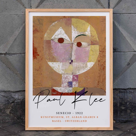 Abstract geometric portrait Senecio by Paul Klee with warm colors and geometric shapes on orange background poster, framed and displayed in home decor