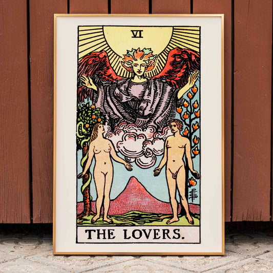 The Lovers Tarot card by Rider Waite featuring a winged angel above a man and woman in a garden illustration and poster, framed and displayed in home decor