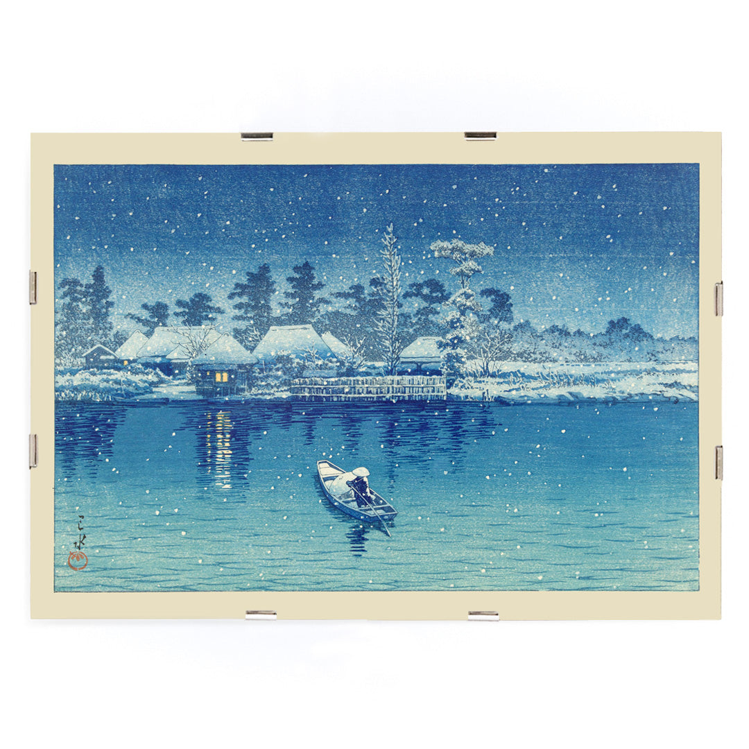 Snowy riverside village at night with boat and person by Kawase Hasui Ushibori Japanese art poster, framed and displayed in modern living room decor