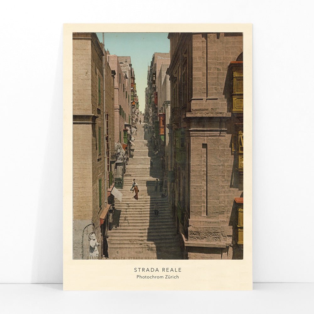 Steep stone staircase and historic street scene with people in Valletta Strada Reale by Photochrom Zurich, framed and displayed in modern living room decor