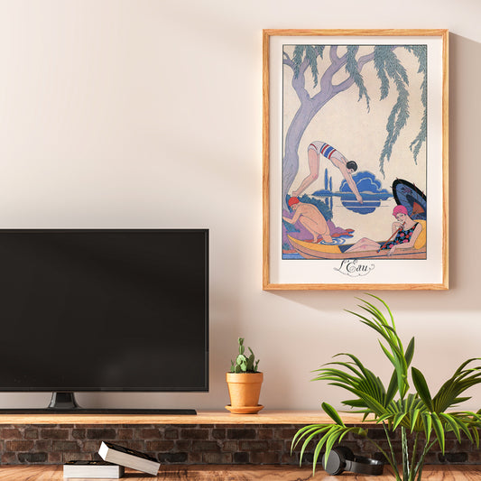 Art deco poster L Eau by George Barbier with three people in swimwear relaxing and boating by a riverside, framed and displayed in home decor