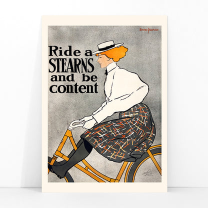 Vintage poster of a woman riding a bicycle with the text Ride a Stearns and be content by Edward Penfield artwork, framed and displayed in modern living room decor
