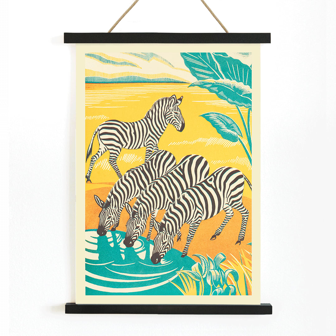 Zebras drinking at a waterhole in vibrant jungle scenery illustration by Clifford Webb from A Jungle Picnic Pl 25 Zebra poster, with wooden magnetic frame on white background